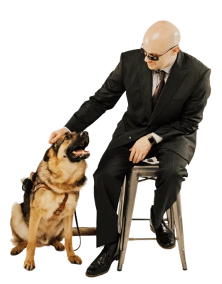 Chad E. Foster with his guide dog Sarge