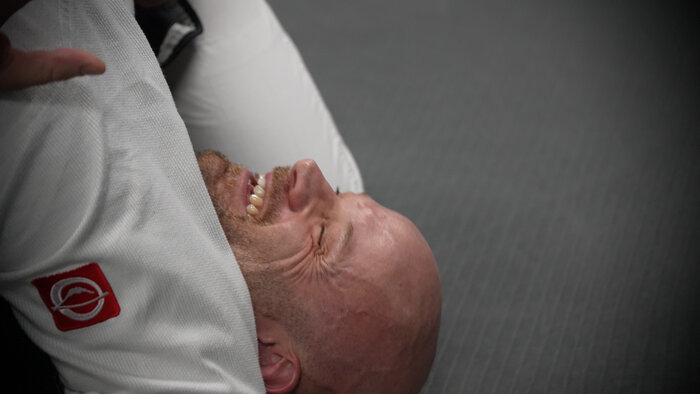 Chad E Foster smiling at BJJ Alliance Dubai after martial arts training