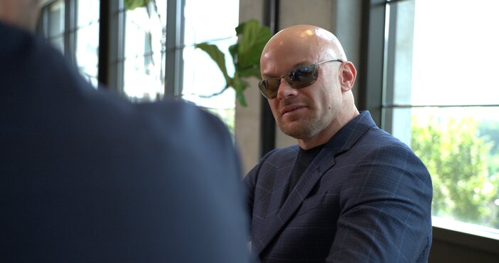 Close-up portrait of Chad E Foster showing confidence and determination