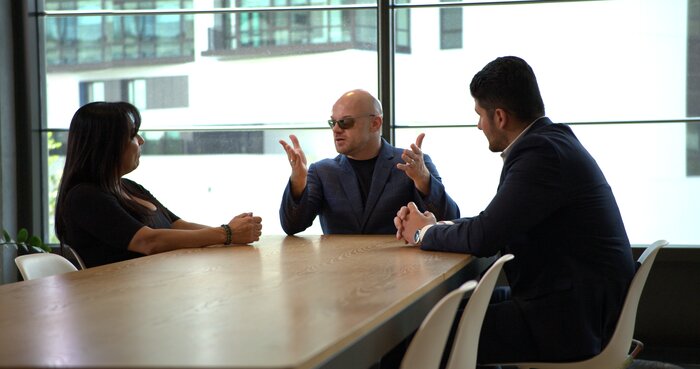 Medium shot of Chad E Foster in corporate meeting discussing leadership principles